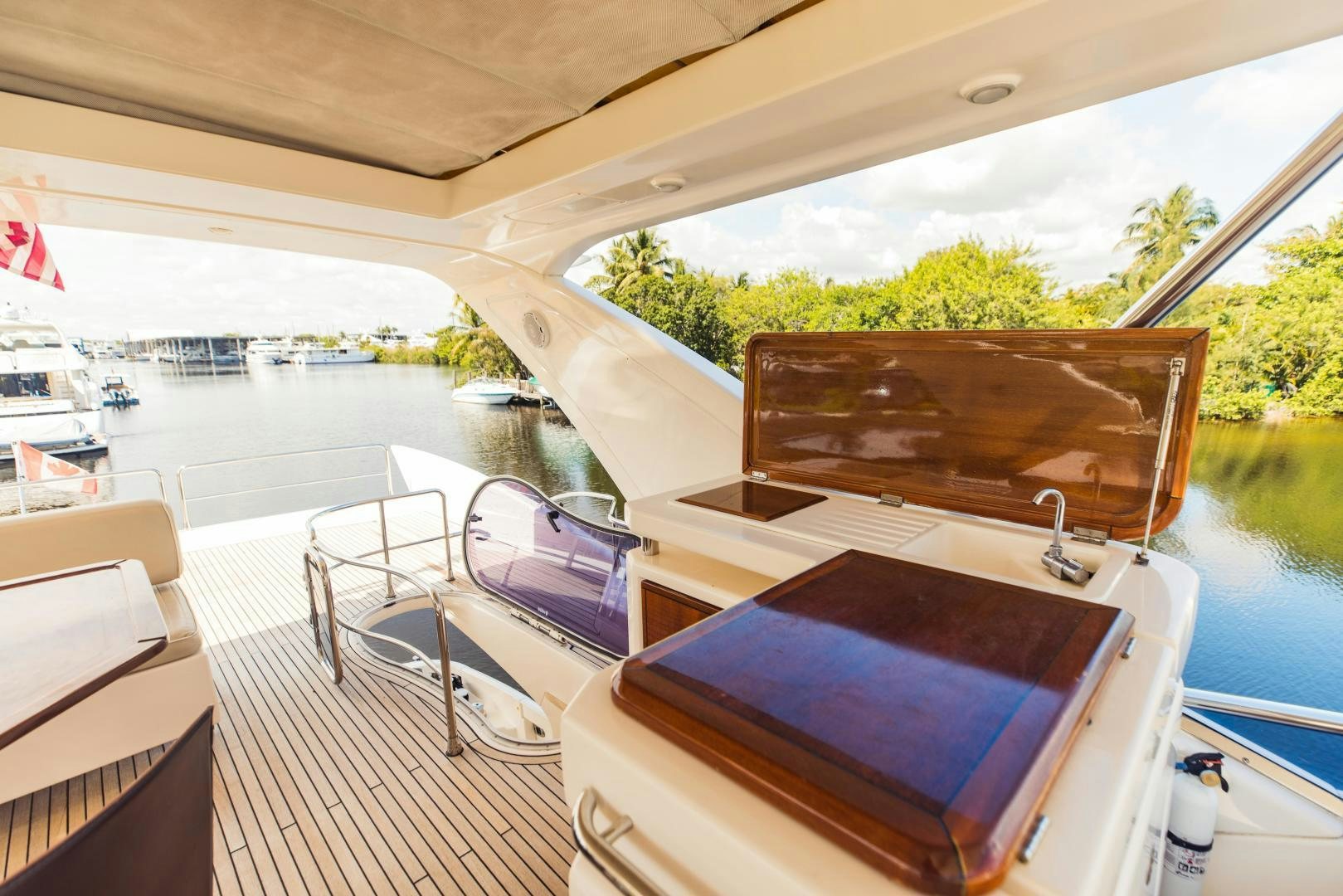 a room with a table and chairs aboard Azimut 70 Yacht for Sale