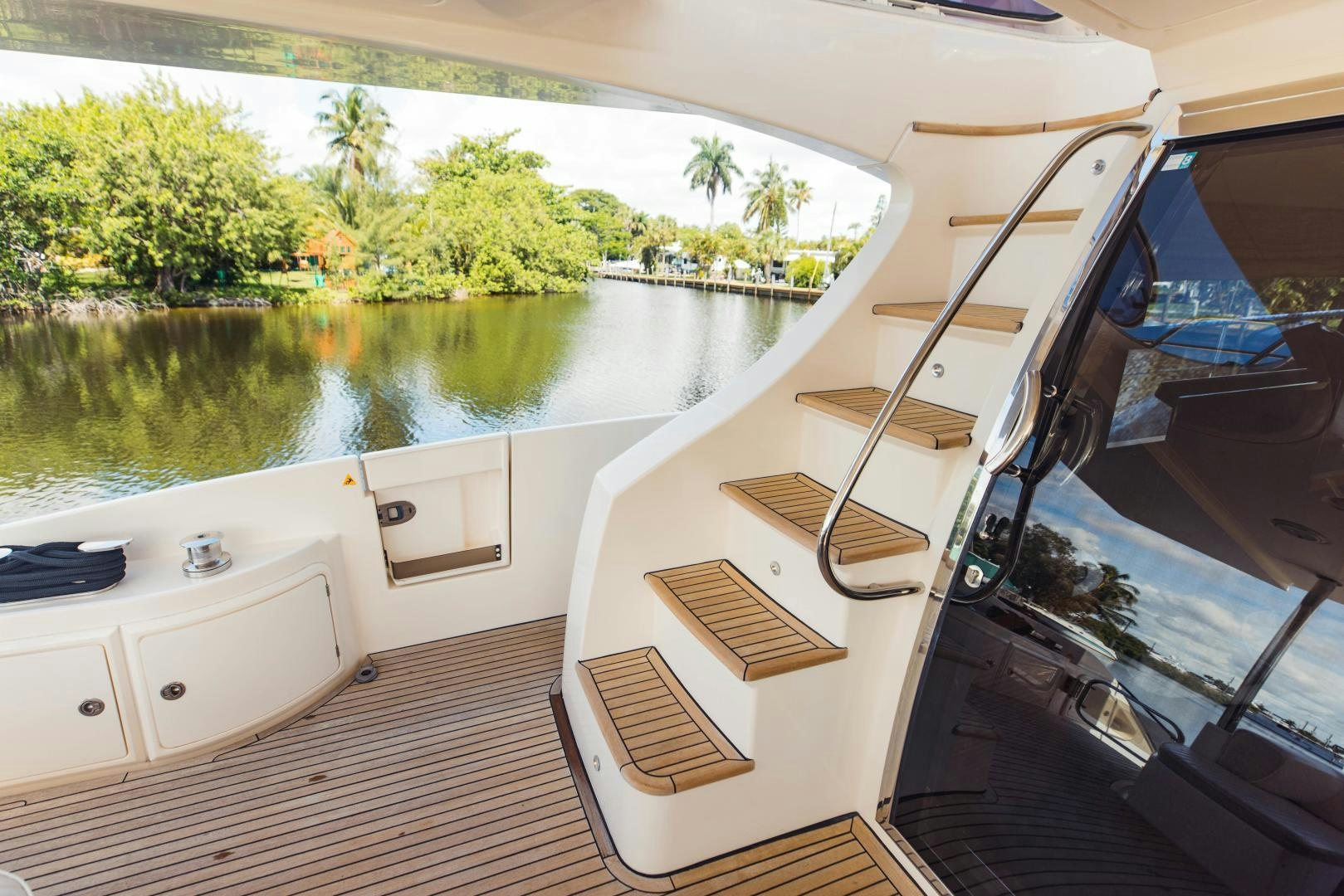 a boat on a river aboard Azimut 70 Yacht for Sale