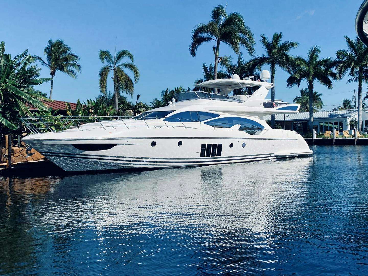 a white yacht in the water aboard Azimut 70 Yacht for Sale