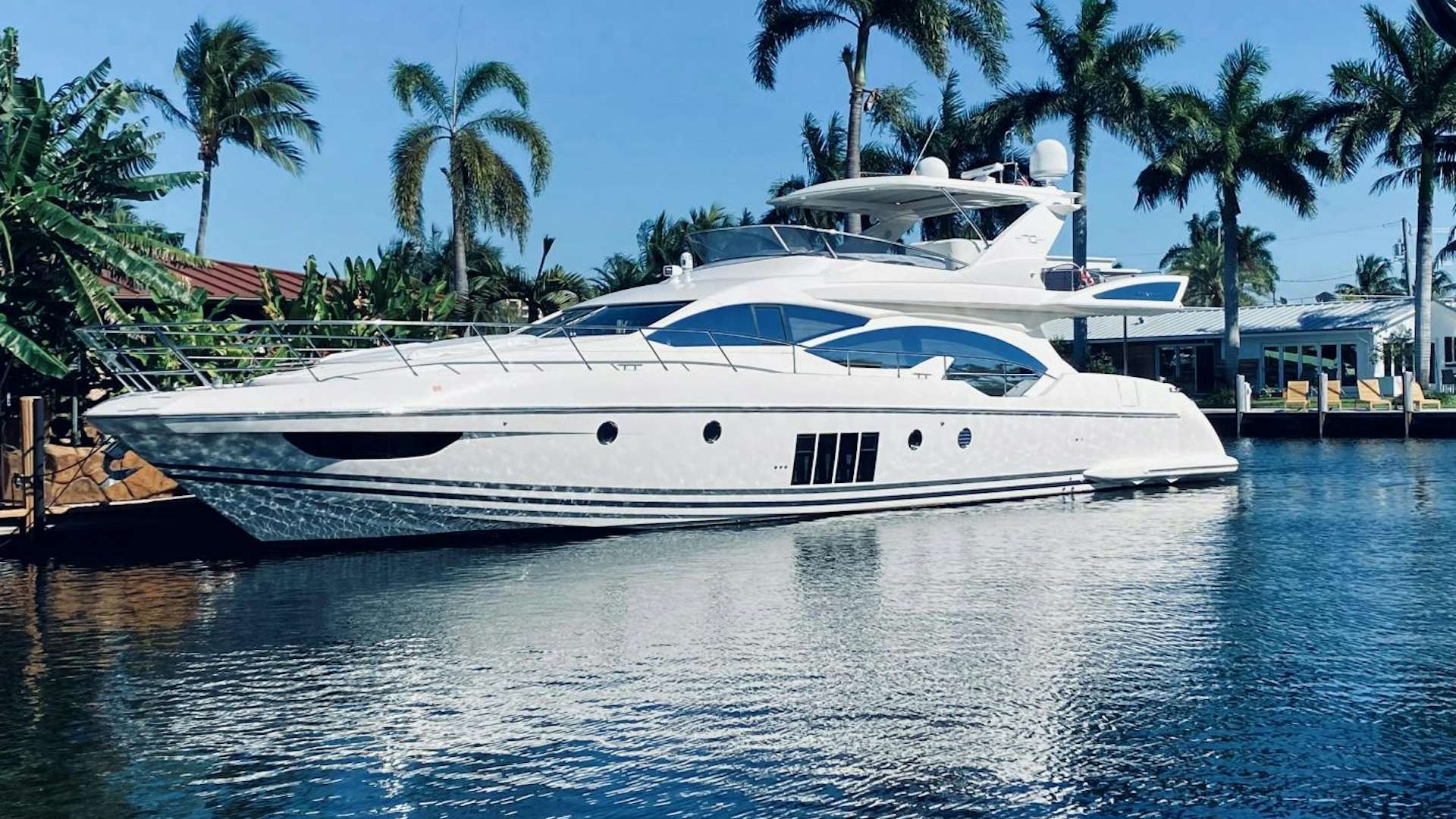 a white yacht in the water aboard Azimut 70 Yacht for Sale