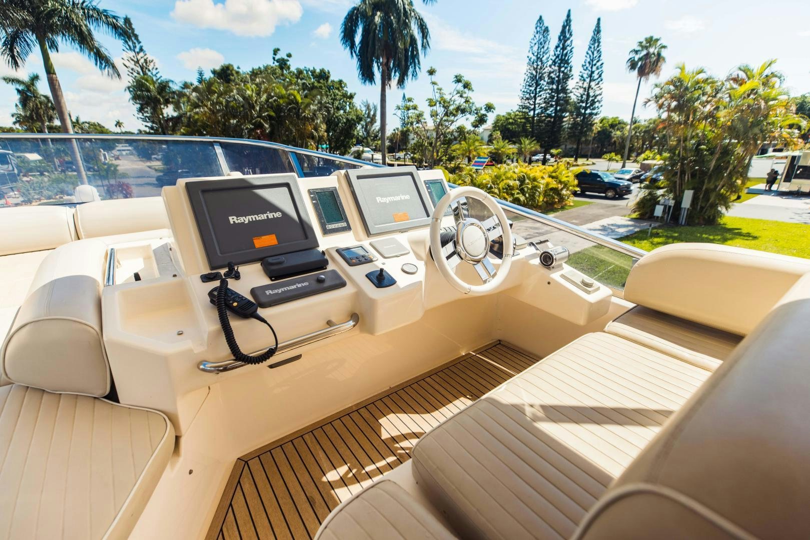 a convertible car on a road aboard Azimut 70 Yacht for Sale