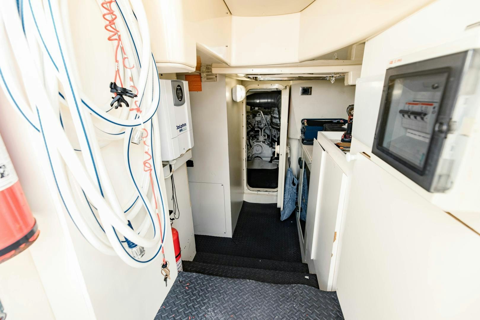 a room with a blue rug and a white wall with a blue rug aboard Azimut 70 Yacht for Sale
