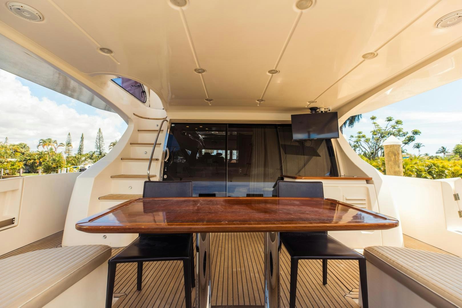 a room with a table and chairs aboard Azimut 70 Yacht for Sale