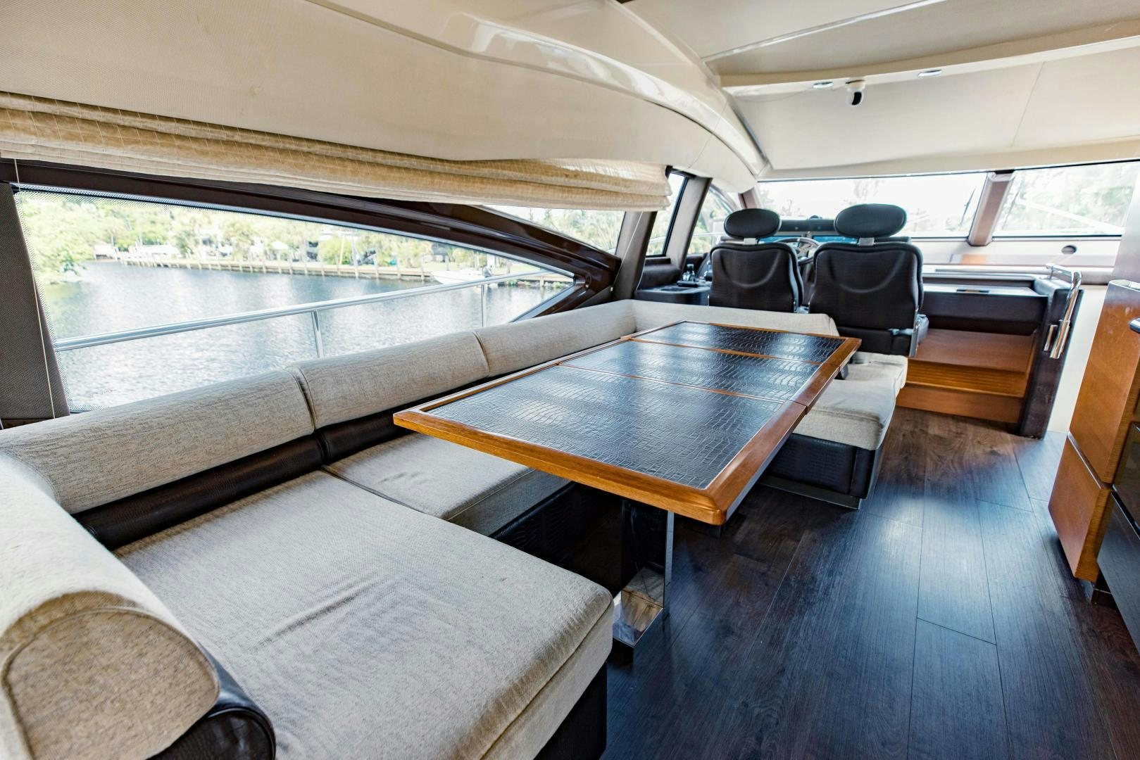 a boat with a table and chairs aboard Azimut 70 Yacht for Sale
