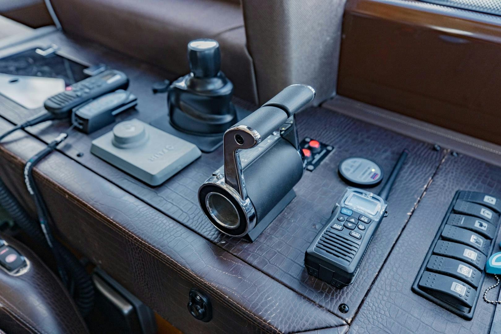 a car with a radio and other electronics on it aboard Azimut 70 Yacht for Sale