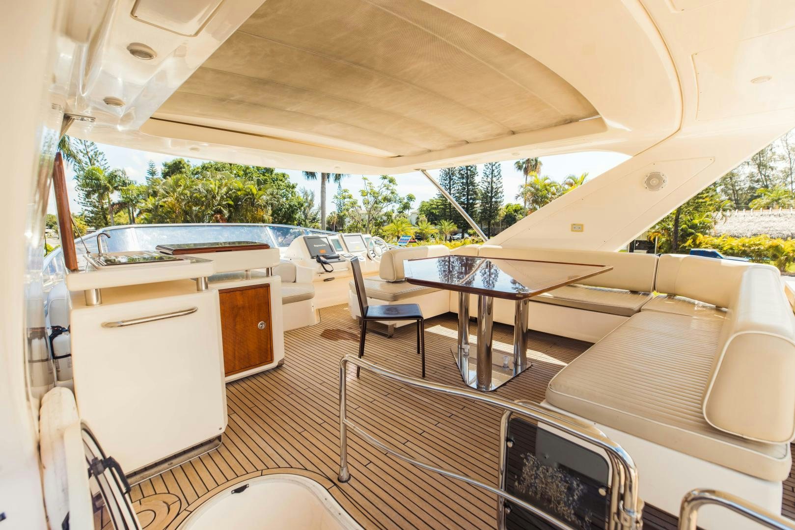 a room with a table and chairs aboard Azimut 70 Yacht for Sale