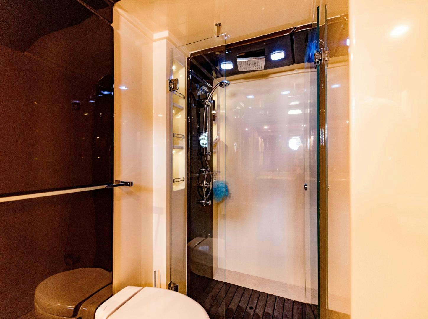 a bathroom with a glass shower aboard Azimut 70 Yacht for Sale
