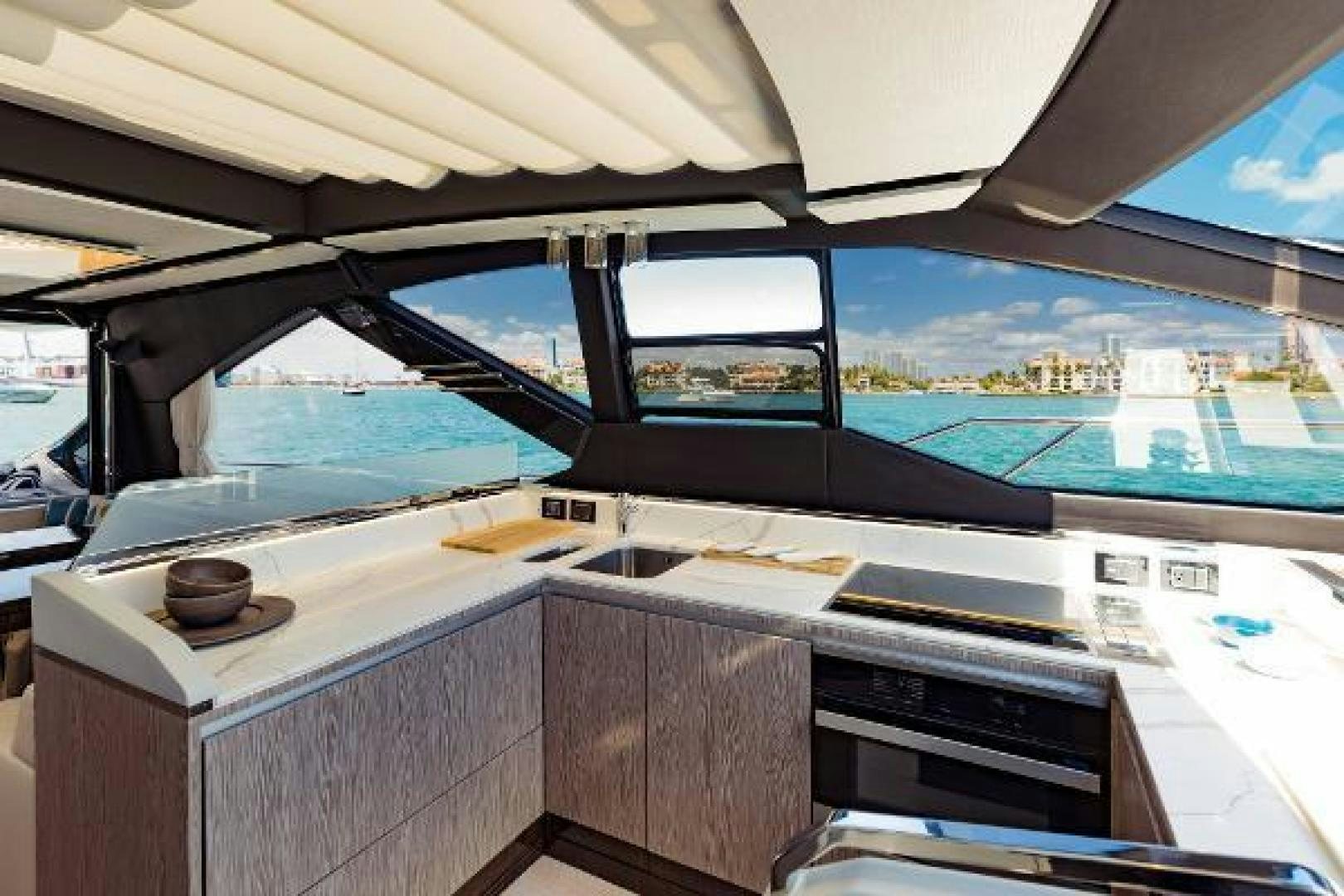 a kitchen with a view of the ocean and the ocean aboard SEA BAR Yacht for Sale