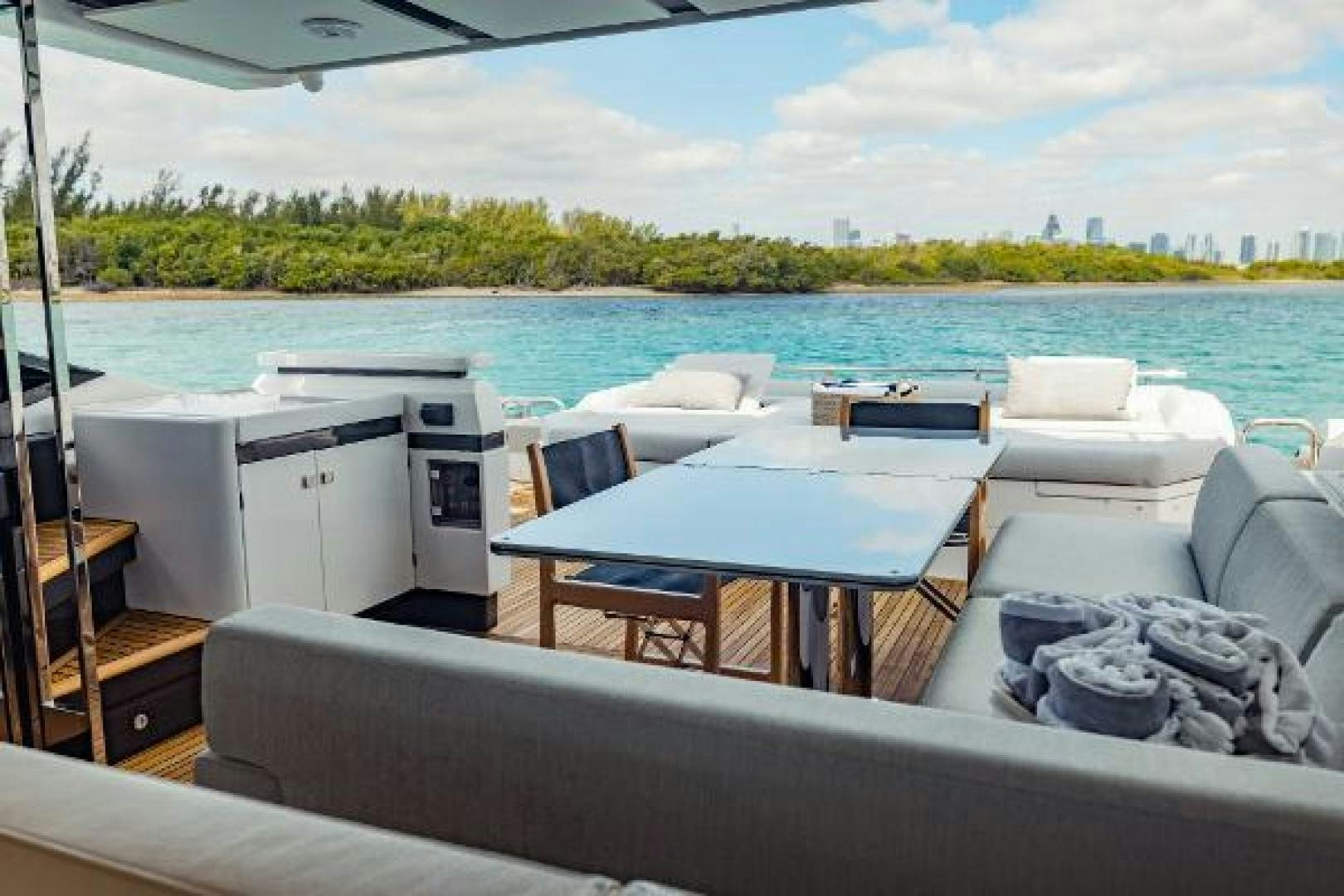 a boat with a table and chairs on it aboard SEA BAR Yacht for Sale
