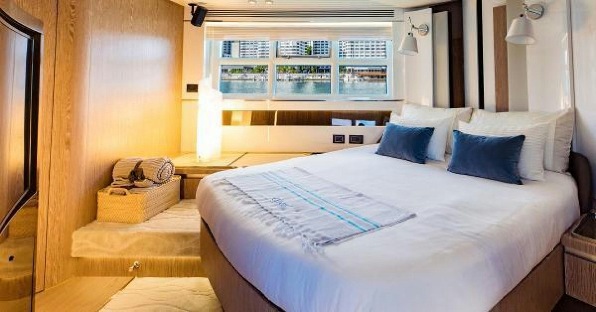 a bed with white sheets aboard SEA BAR Yacht for Sale