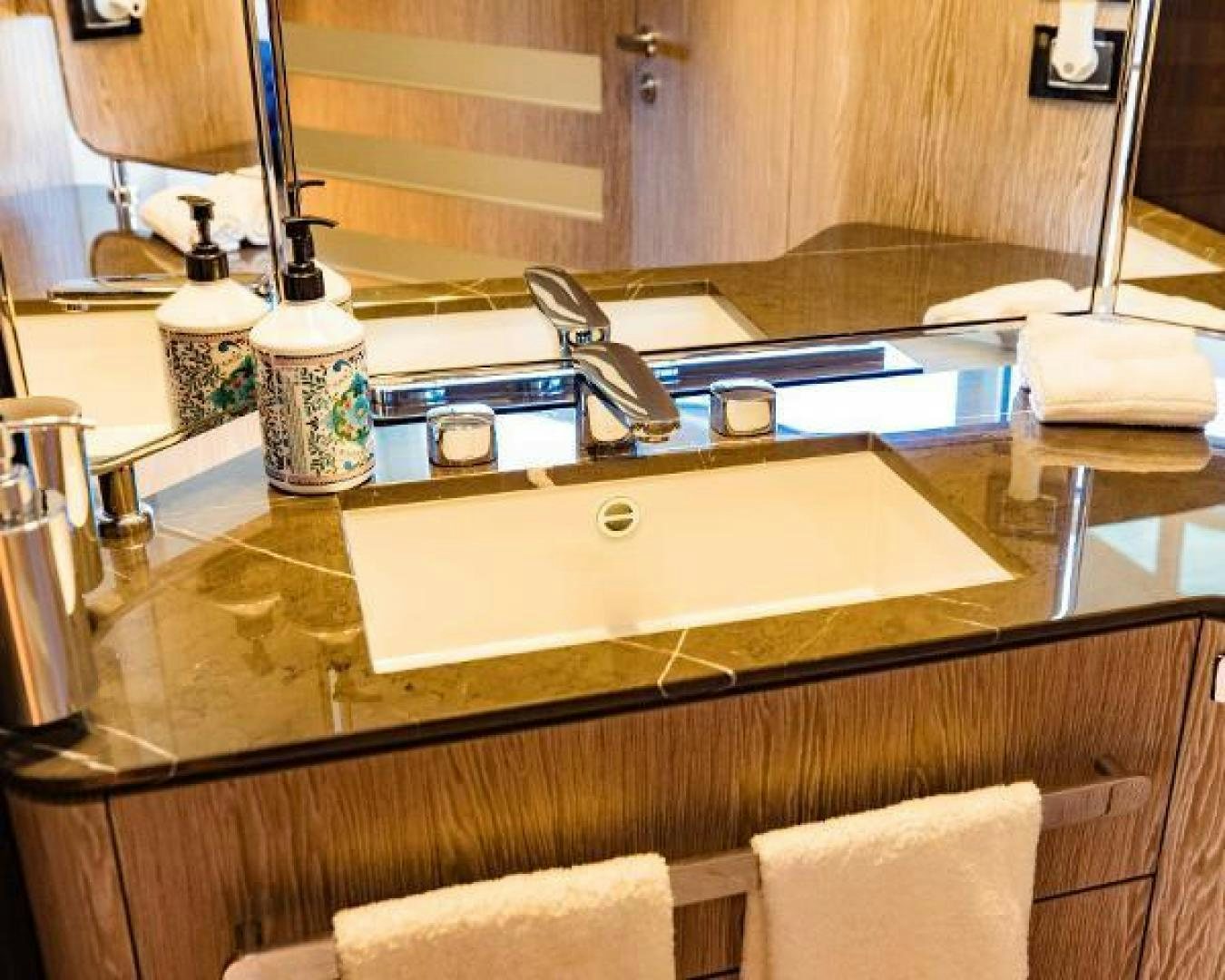 a bathroom sink with a large mirror aboard SEA BAR Yacht for Sale