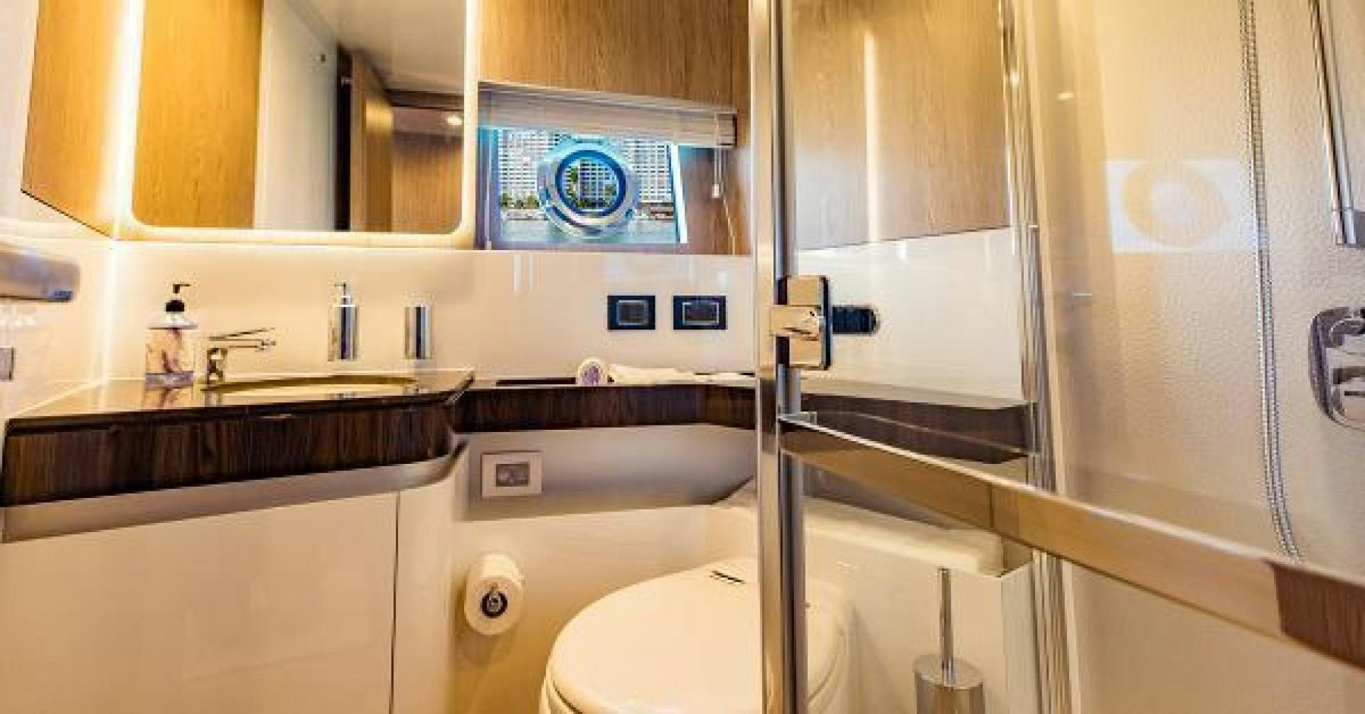 a bathroom with a glass shower aboard SEA BAR Yacht for Sale
