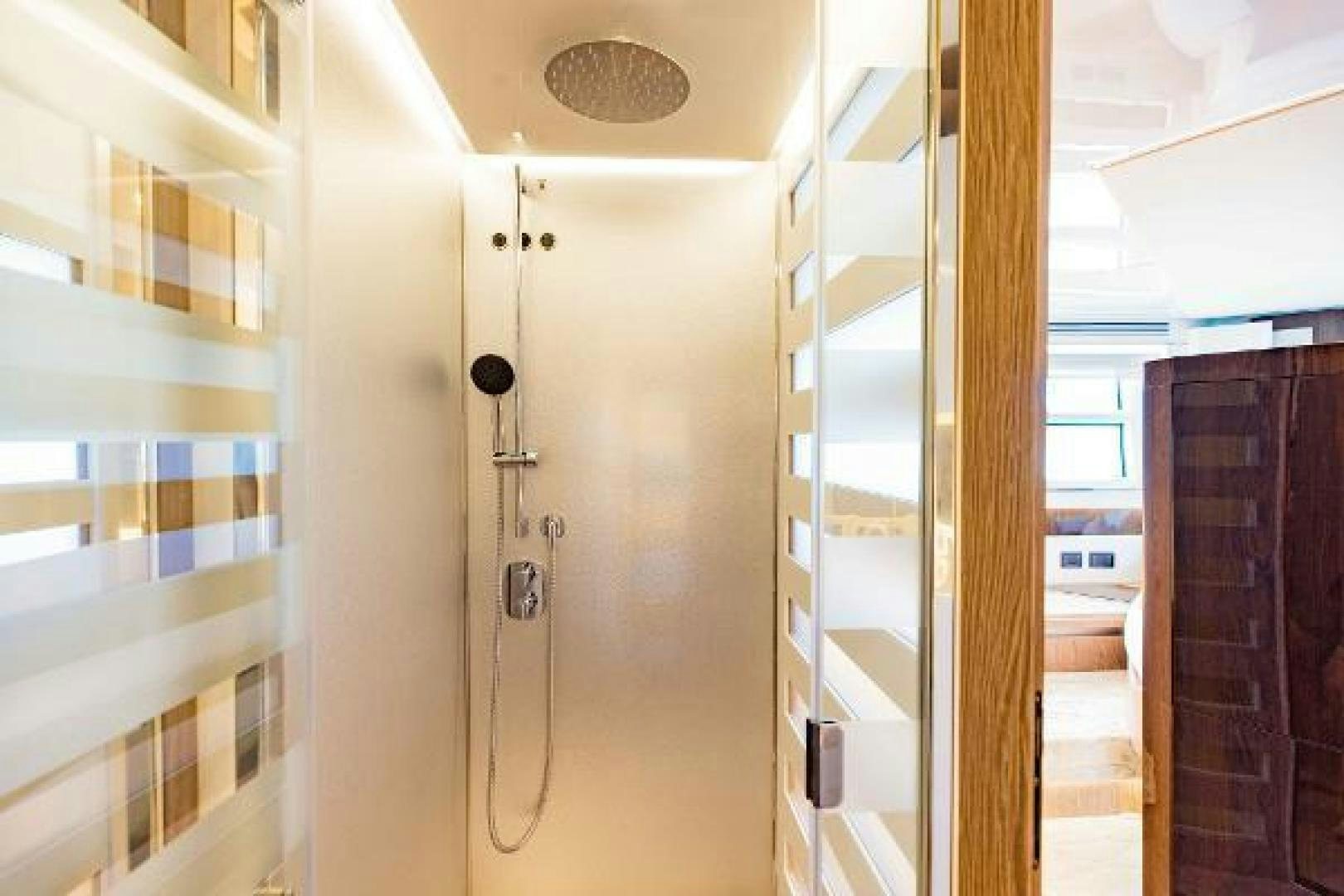 a room with a door and a mirror aboard SEA BAR Yacht for Sale