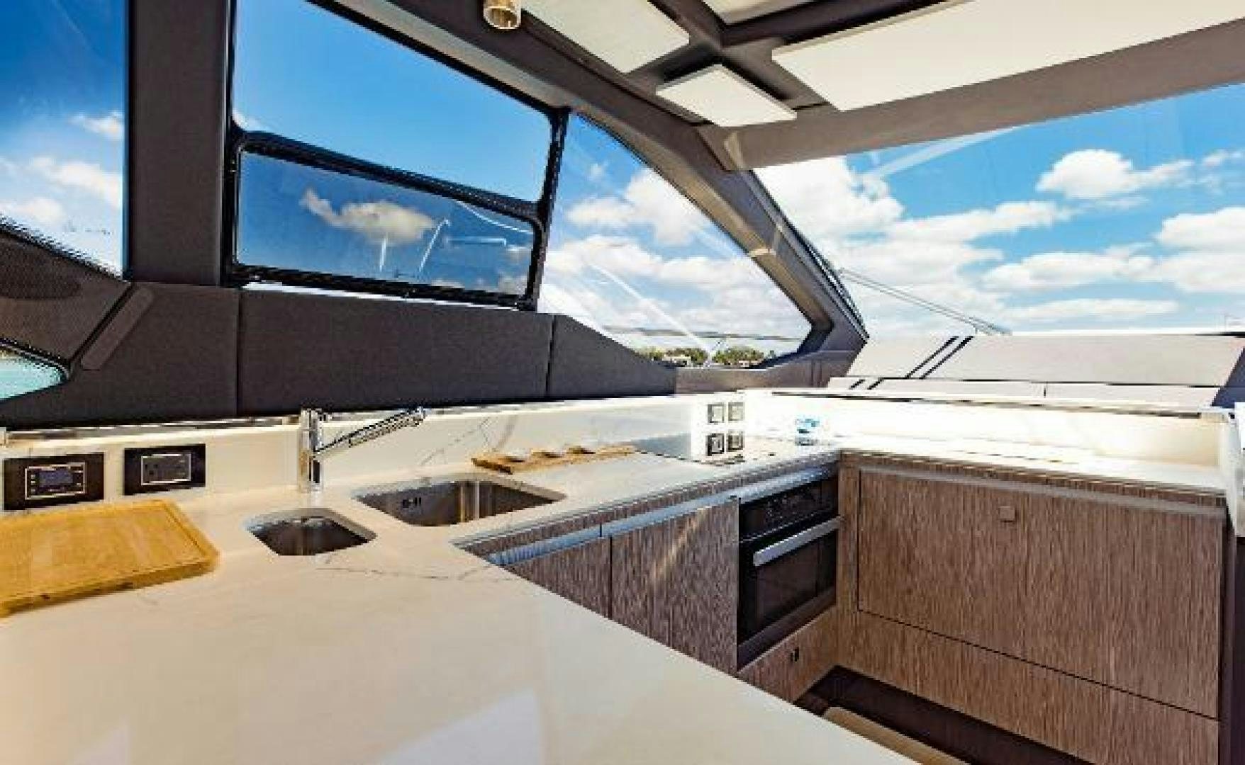 a kitchen with a large window aboard SEA BAR Yacht for Sale