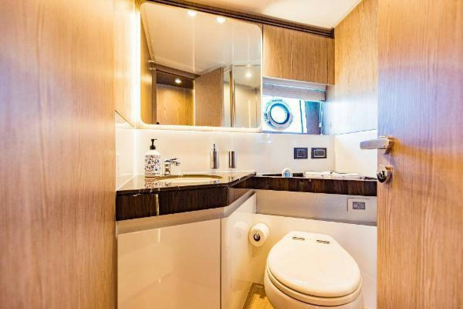 a bathroom with a toilet and a sink aboard SEA BAR Yacht for Sale