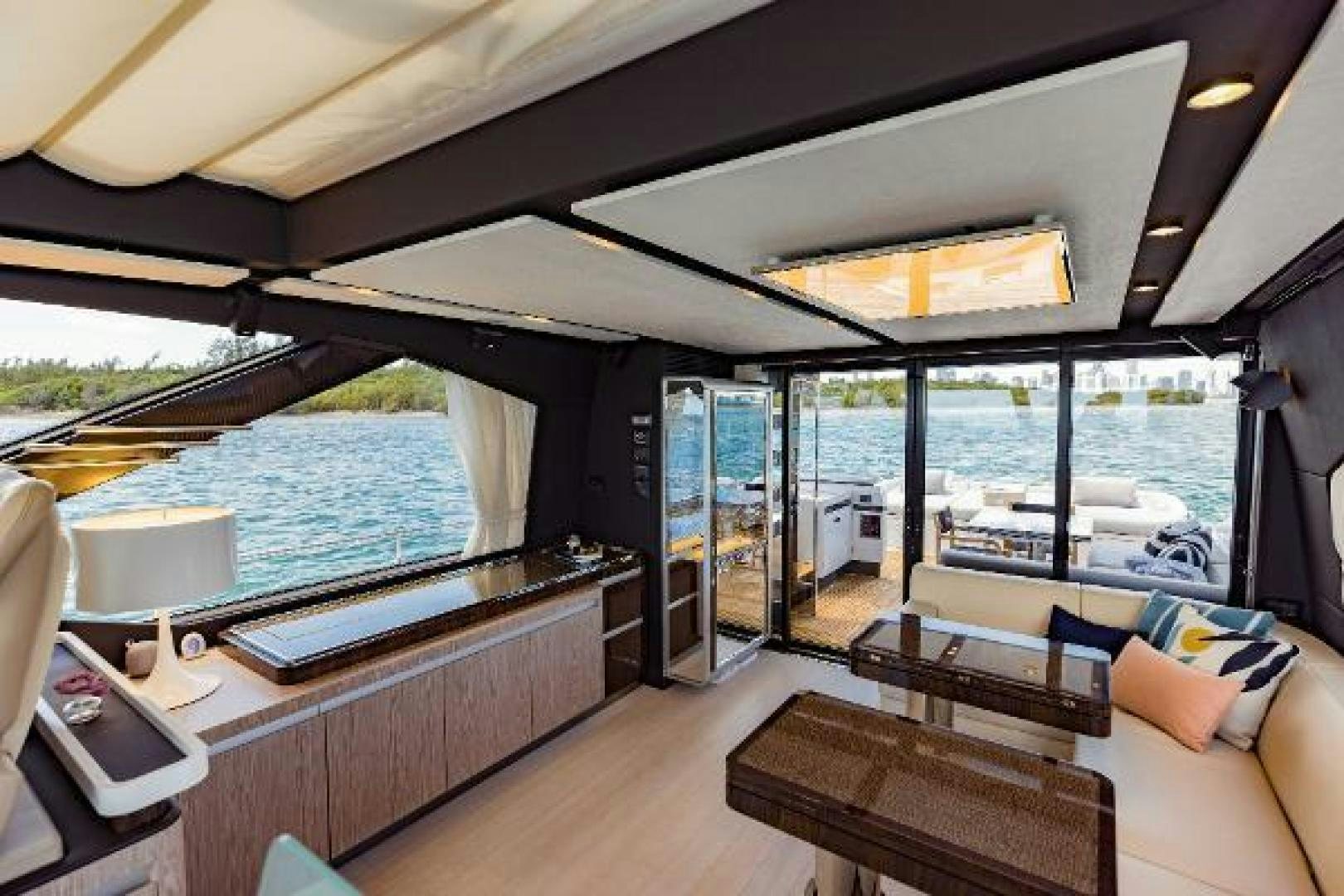 a room with a view of the water and the deck aboard SEA BAR Yacht for Sale