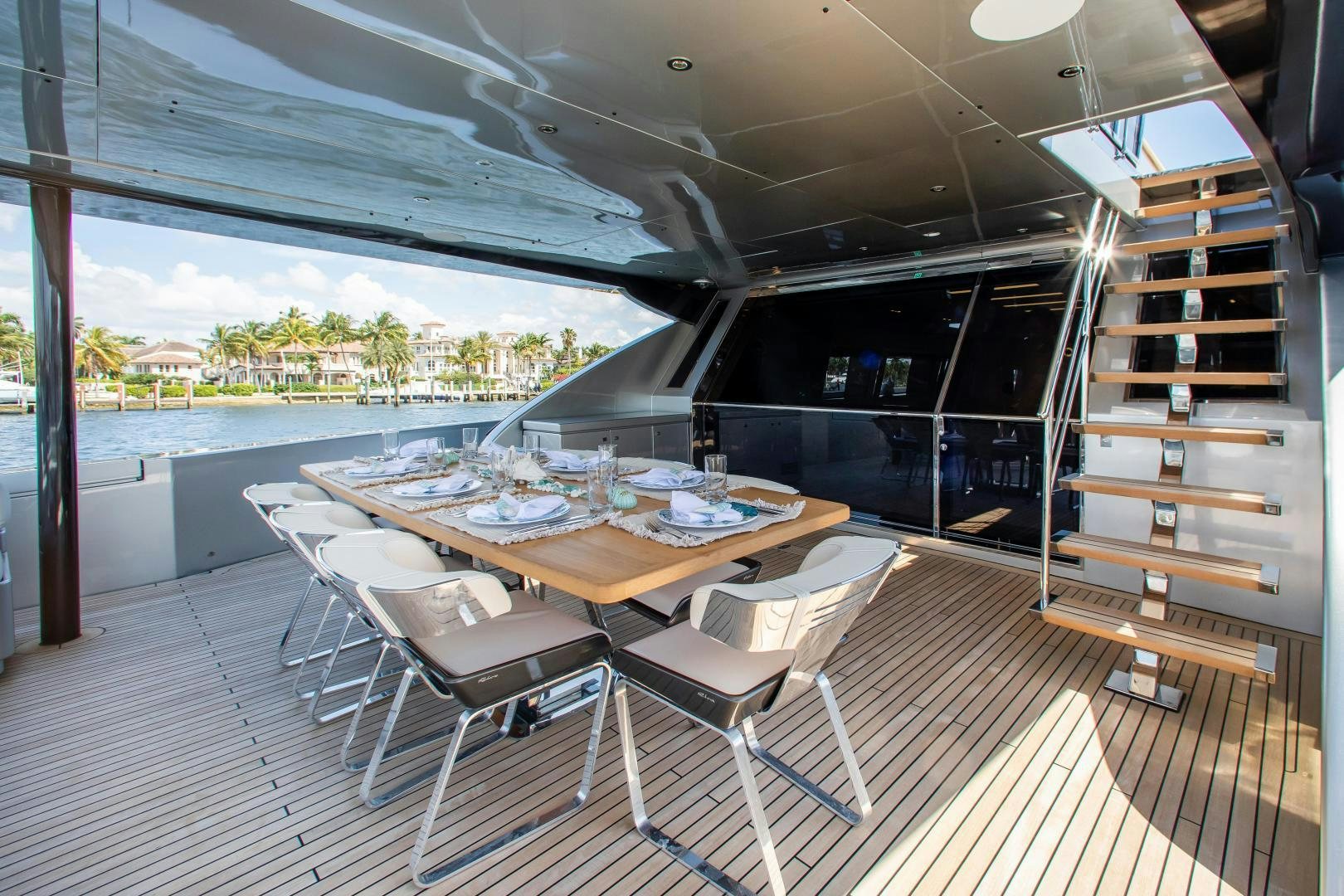 a room with a table chairs and a window aboard CHOP CHOP Yacht for Sale