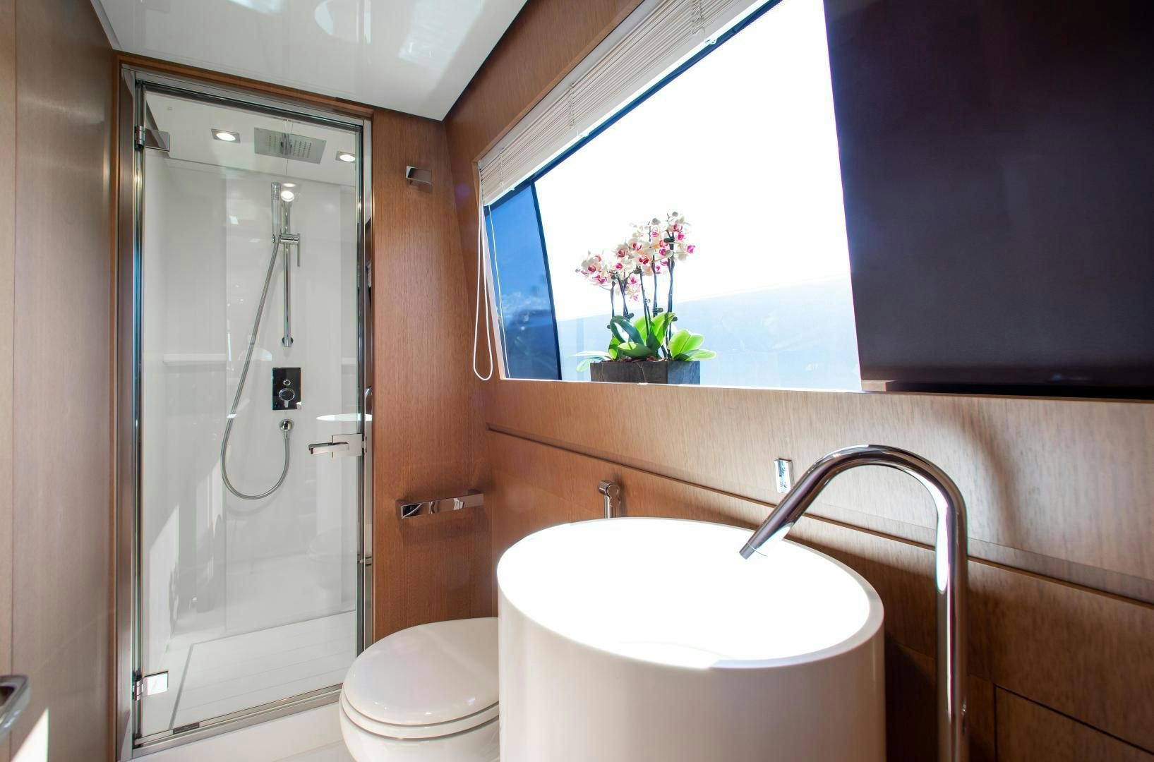 a bathroom with a shower and toilet aboard CHOP CHOP Yacht for Sale