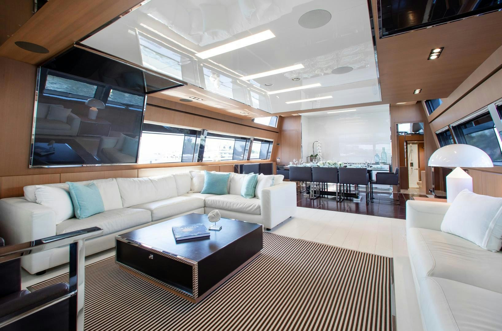 a living room with a couch and a table aboard CHOP CHOP Yacht for Sale