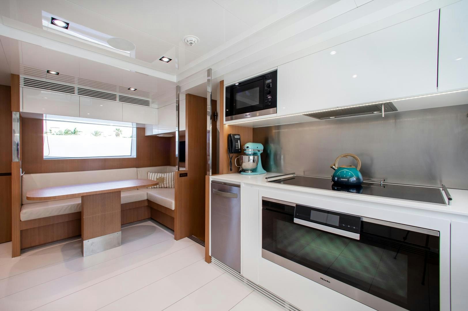 a kitchen with a stove and a microwave aboard CHOP CHOP Yacht for Sale
