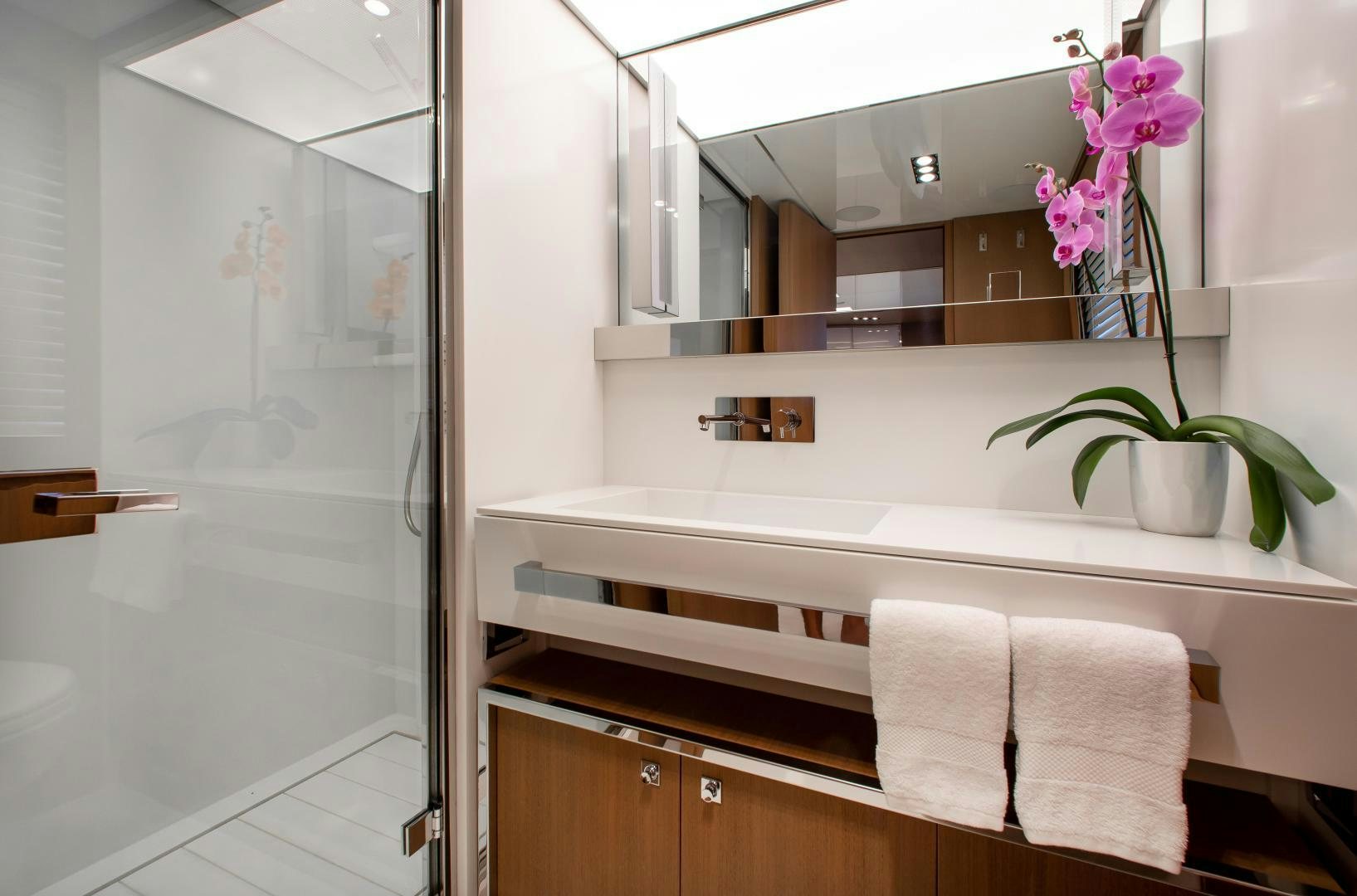 a bathroom with a large mirror aboard CHOP CHOP Yacht for Sale