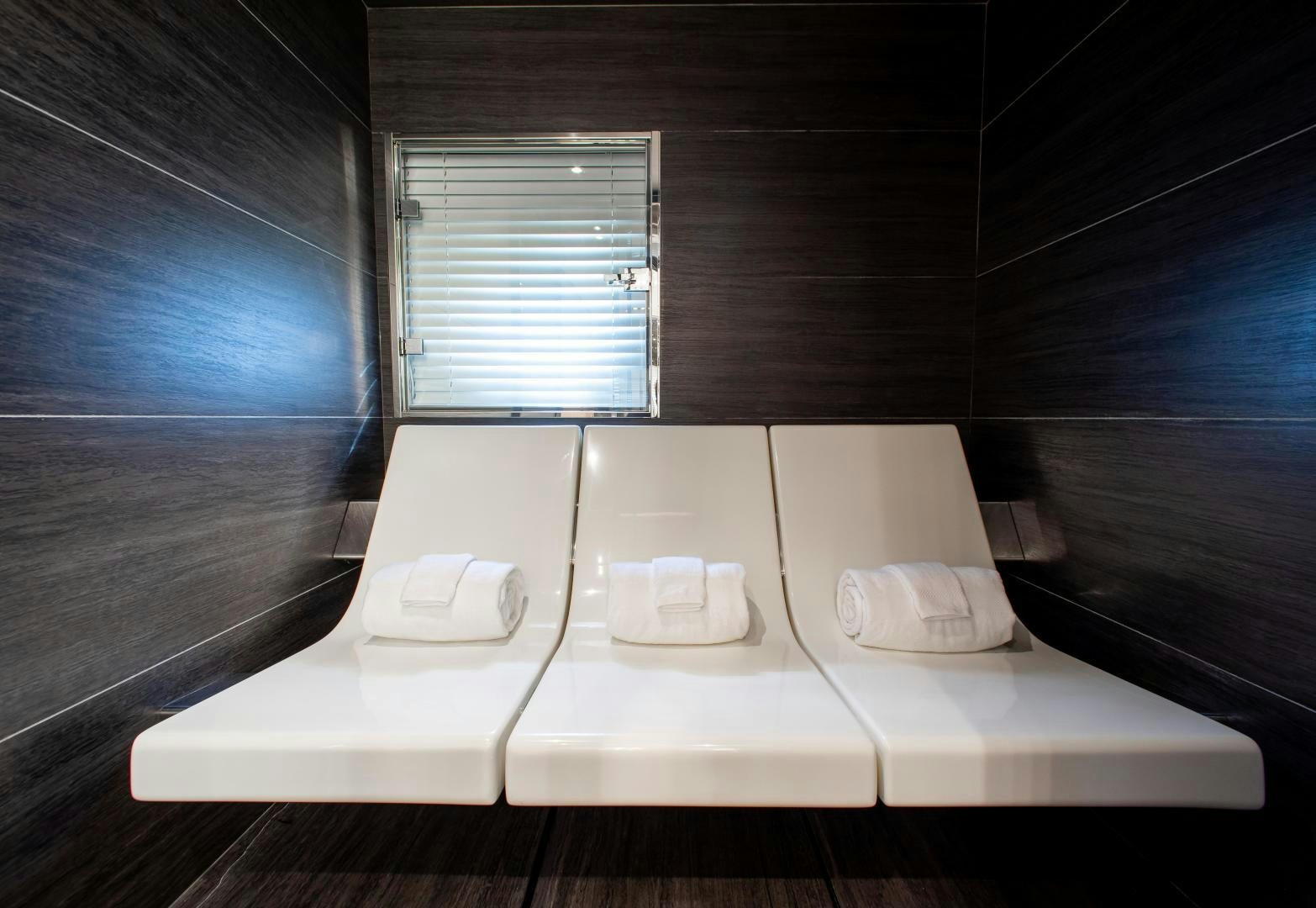 a room with a table and chairs aboard CHOP CHOP Yacht for Sale