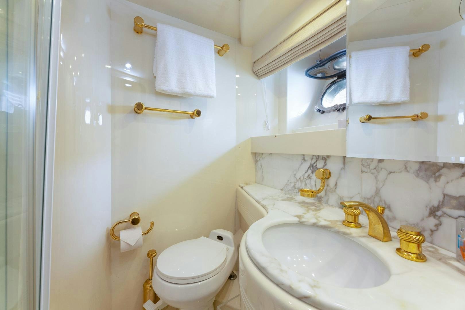 a bathroom with a toilet and sink aboard GRAVITY Yacht for Sale