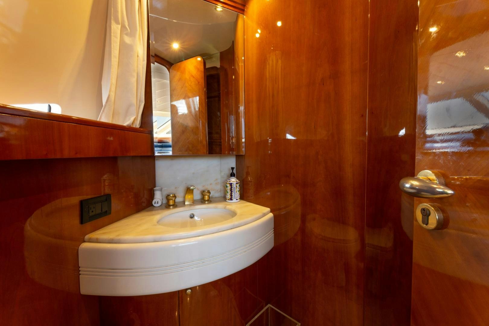 a bathroom with a sink and a mirror aboard GRAVITY Yacht for Sale