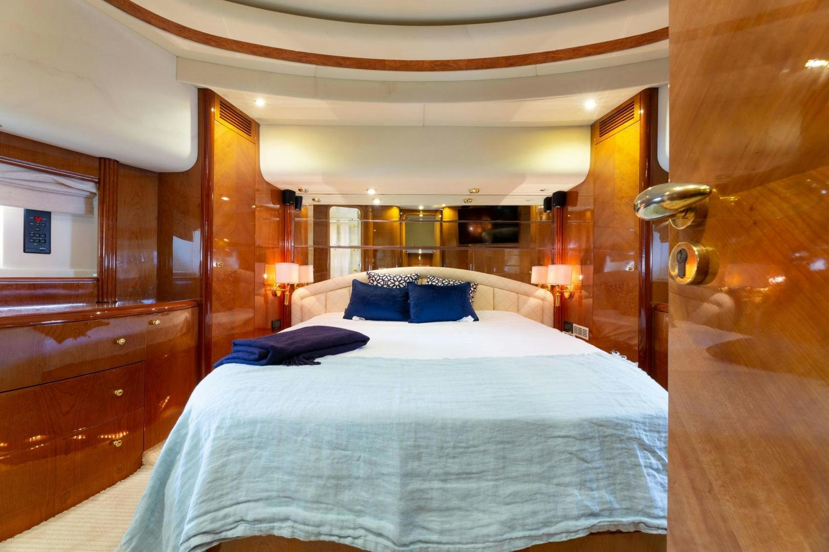 a bed with a blue pillow aboard GRAVITY Yacht for Sale