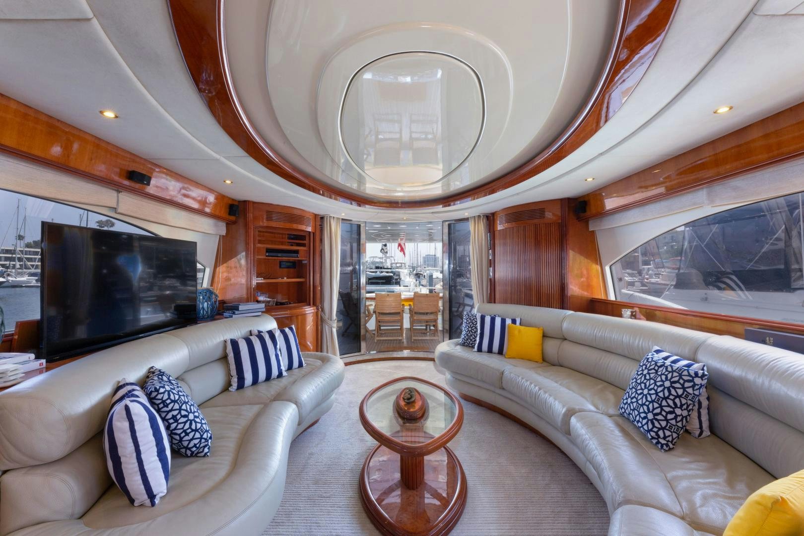 a living room with a large chandelier aboard GRAVITY Yacht for Sale