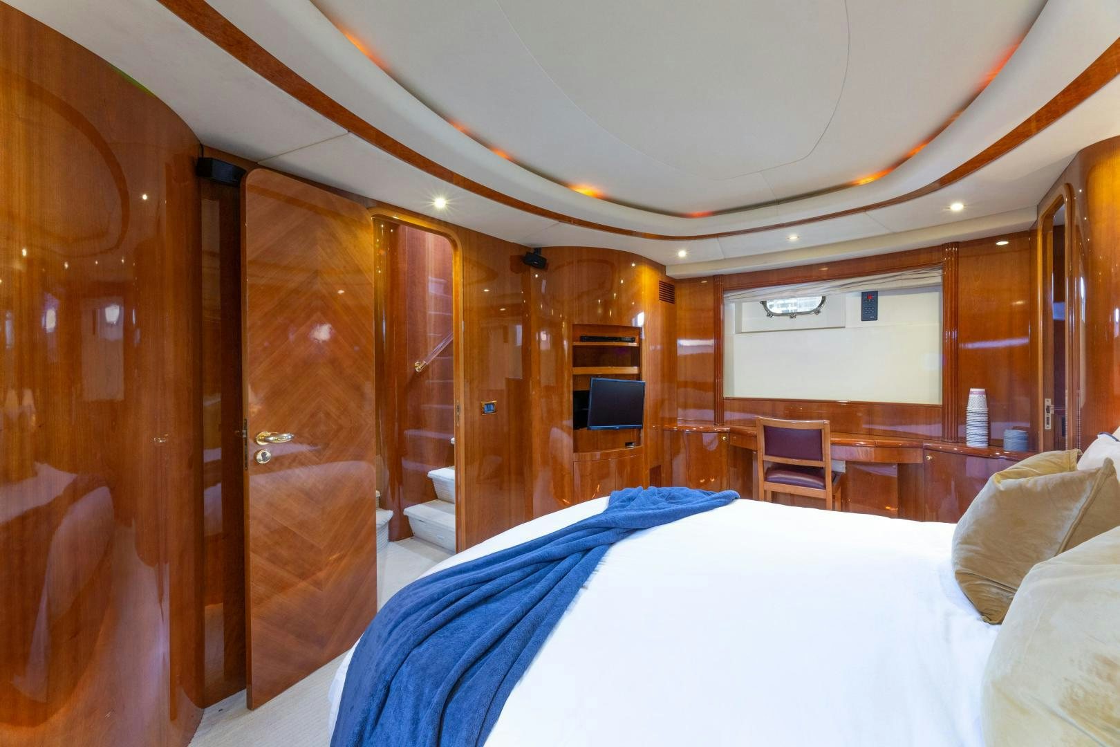 a room with a bed and a television aboard GRAVITY Yacht for Sale