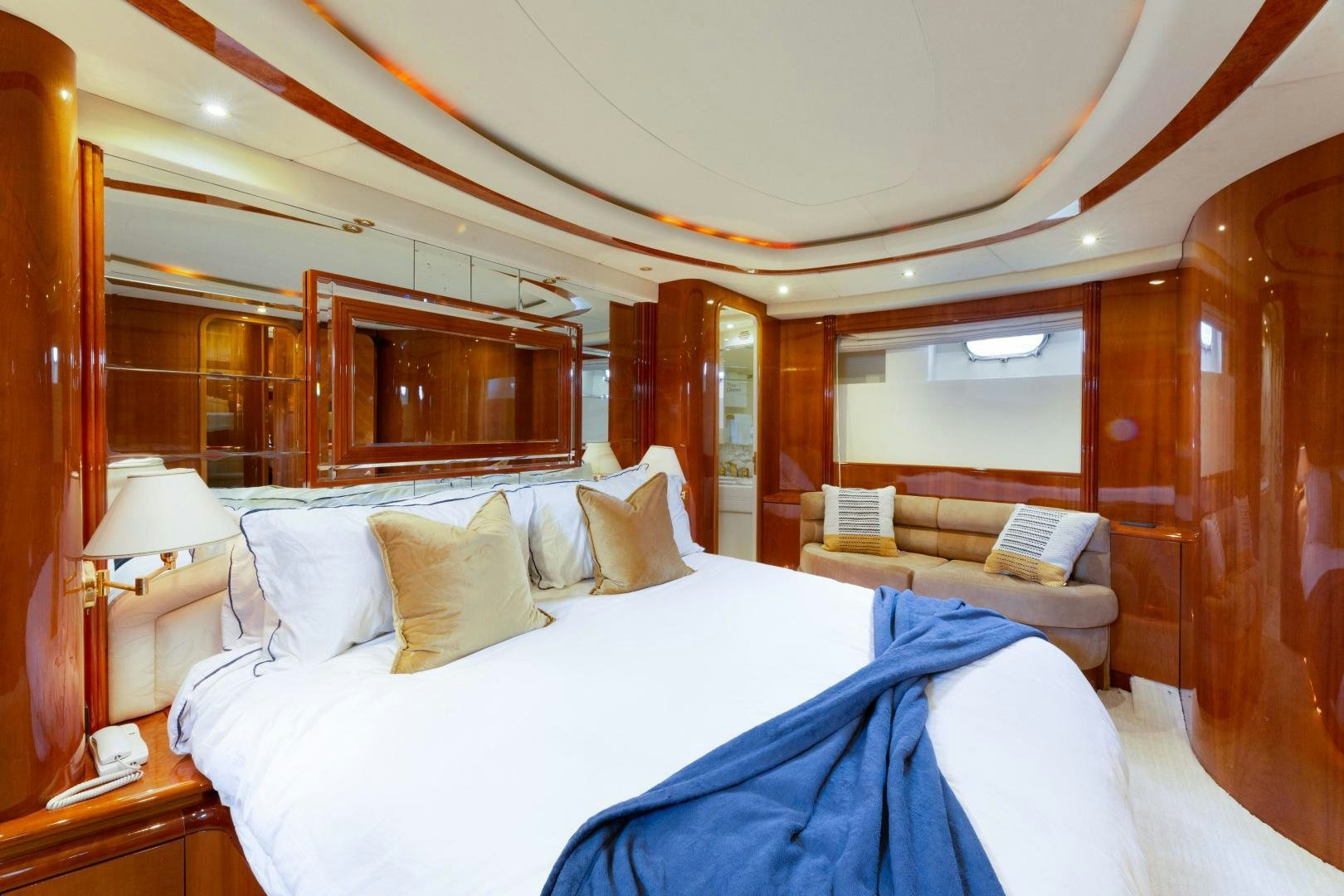 a room with a bed and a couch aboard GRAVITY Yacht for Sale