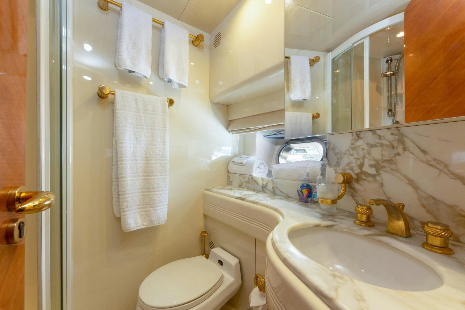 a bathroom with a toilet and sink aboard GRAVITY Yacht for Sale