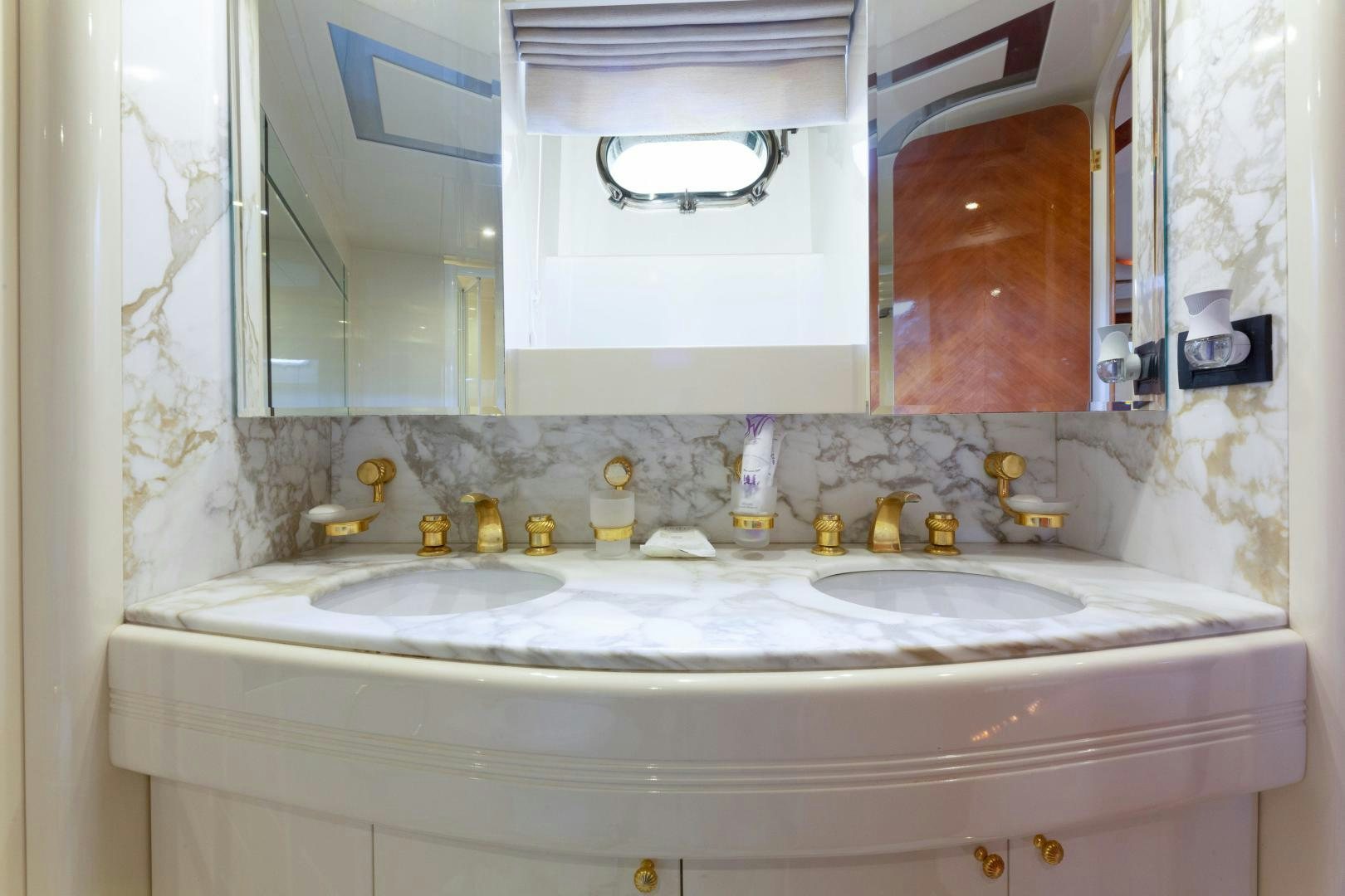 a bathroom with a large mirror aboard GRAVITY Yacht for Sale