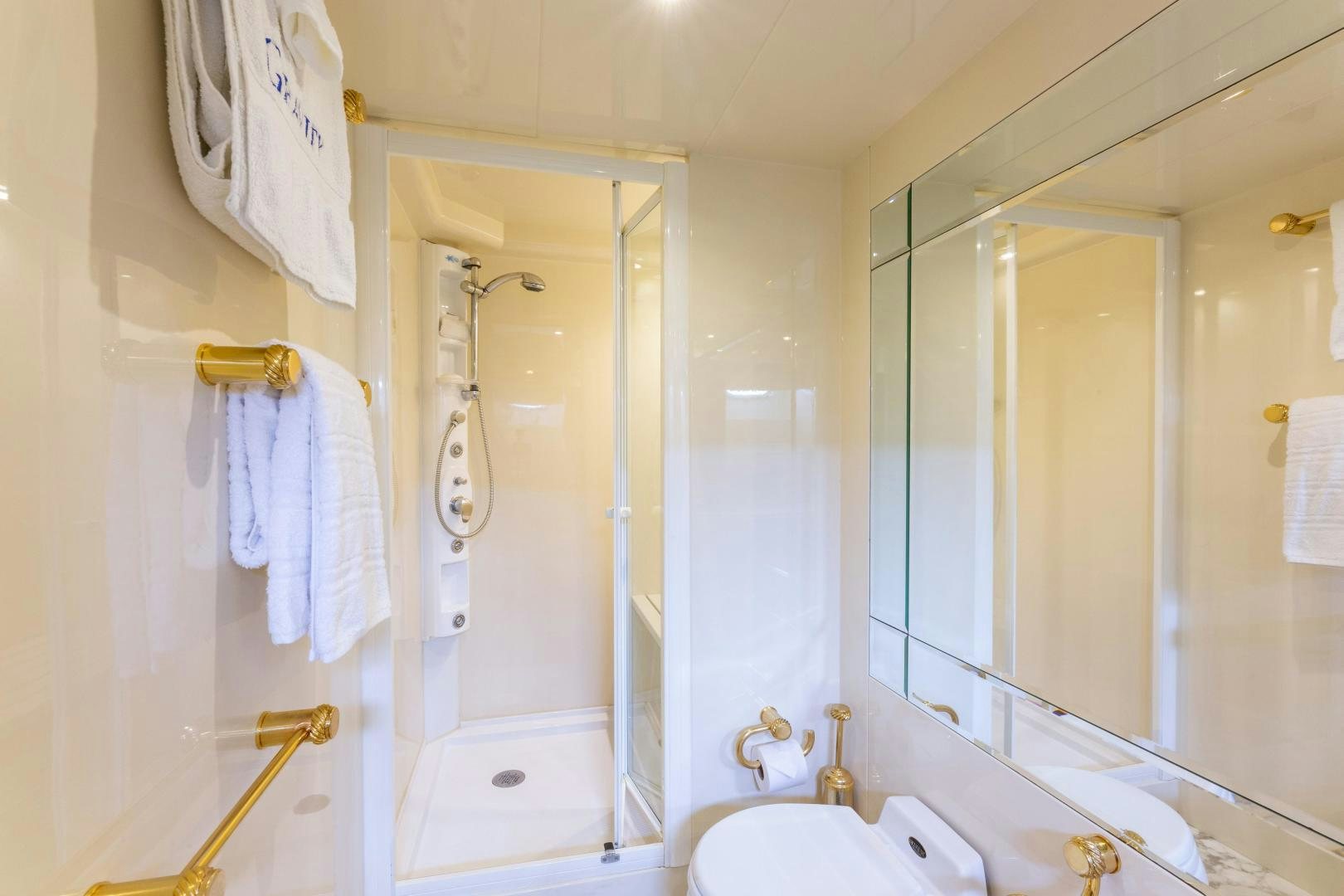 a bathroom with a shower and sink aboard GRAVITY Yacht for Sale