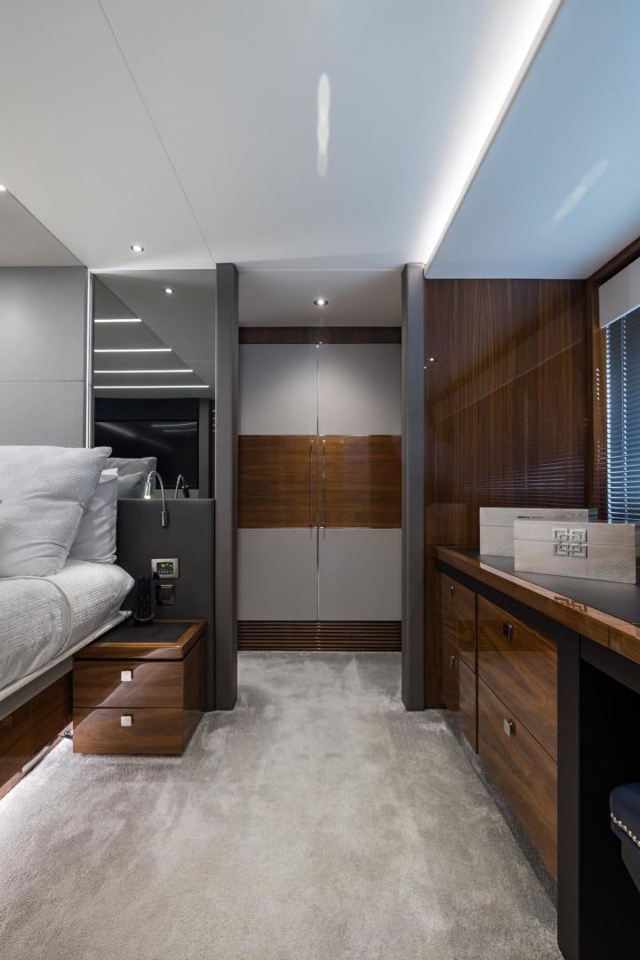 a room with a bed and a desk aboard MR. G Yacht for Sale