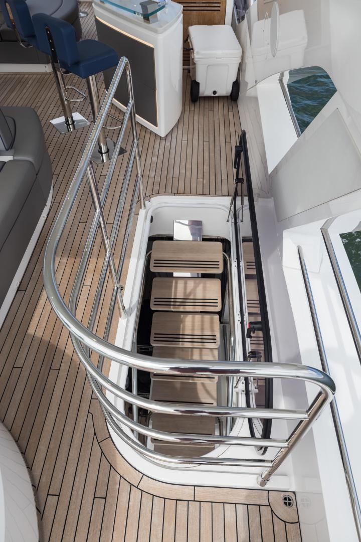 a metal staircase in a room aboard MR. G Yacht for Sale