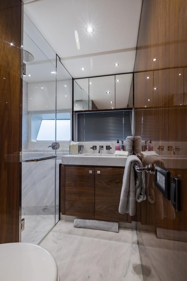 a bathroom with wooden cabinets aboard MR. G Yacht for Sale