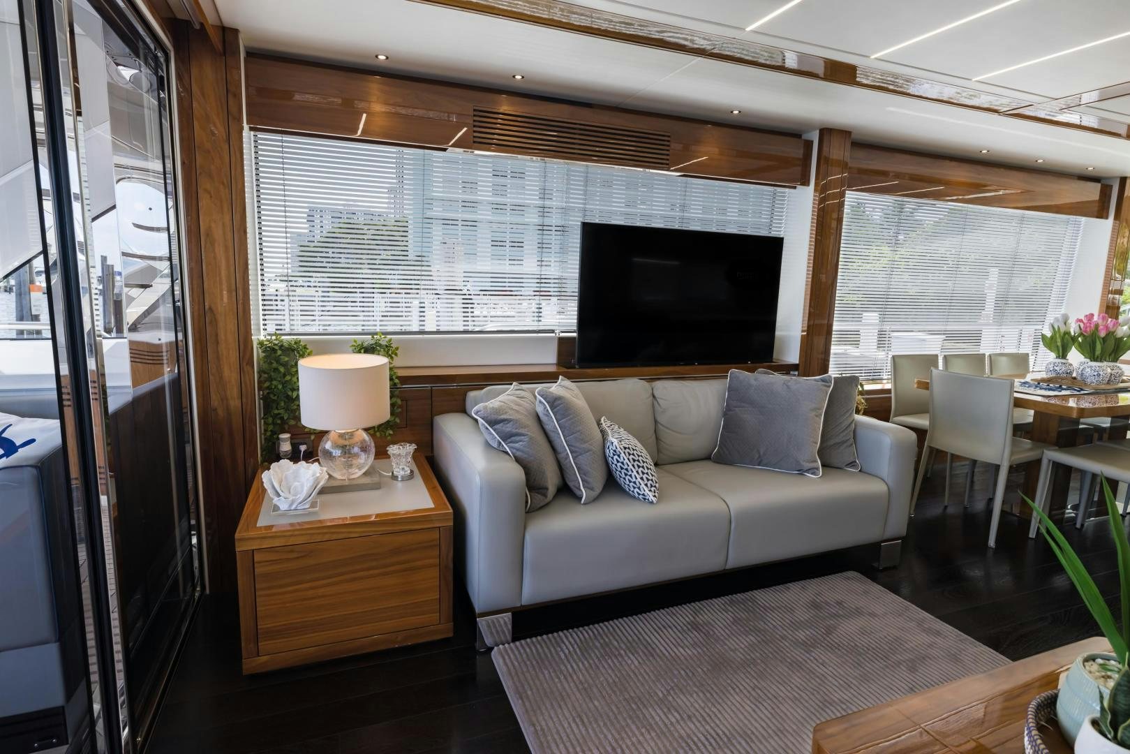 a living room with a couch and a tv aboard MR. G Yacht for Sale