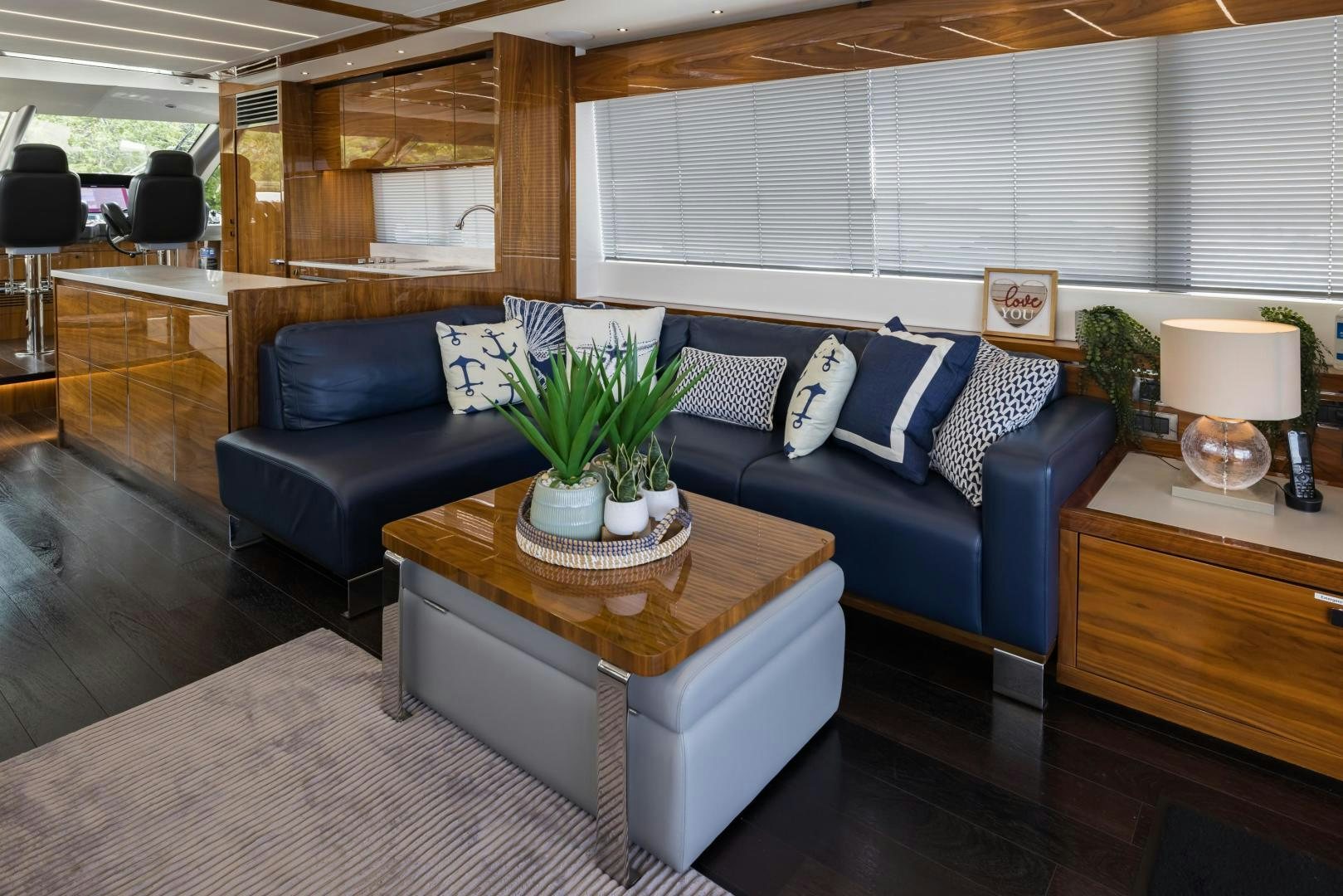 a living room with a couch and a coffee table aboard MR. G Yacht for Sale