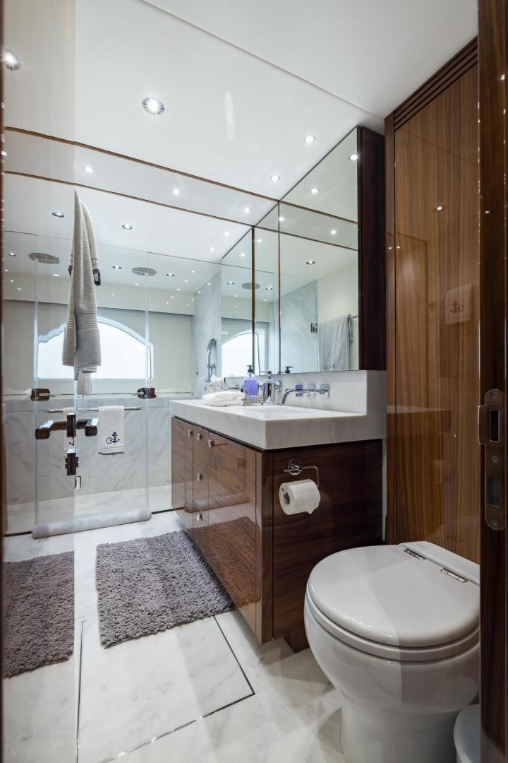 a bathroom with a sink toilet and a shower aboard MR. G Yacht for Sale
