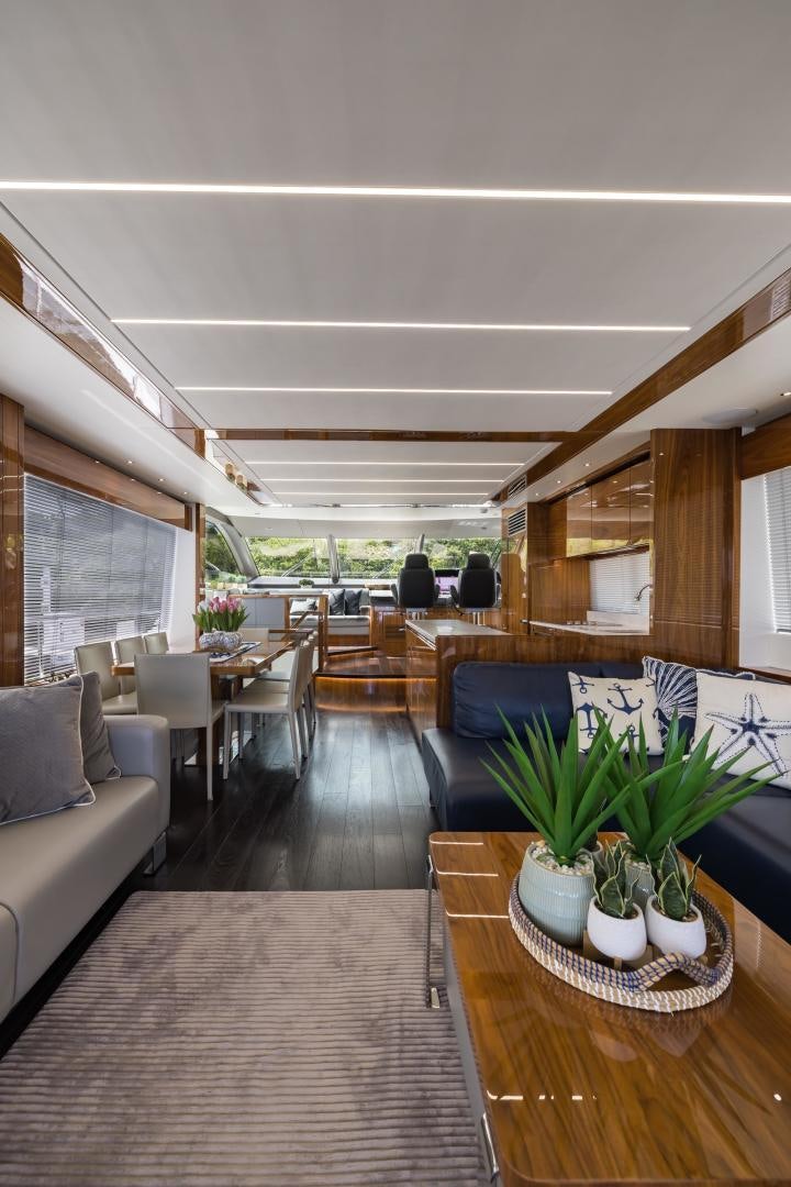 a living room with a wood floor aboard MR. G Yacht for Sale
