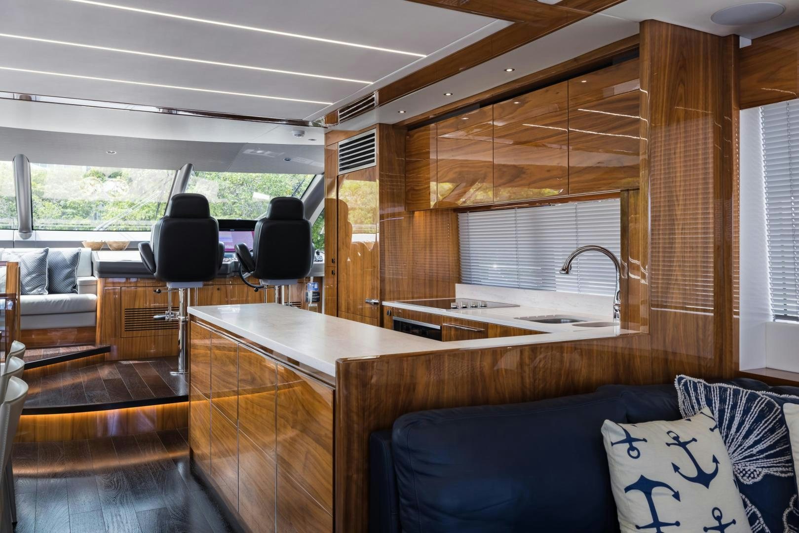 a large open kitchen and living room aboard MR. G Yacht for Sale