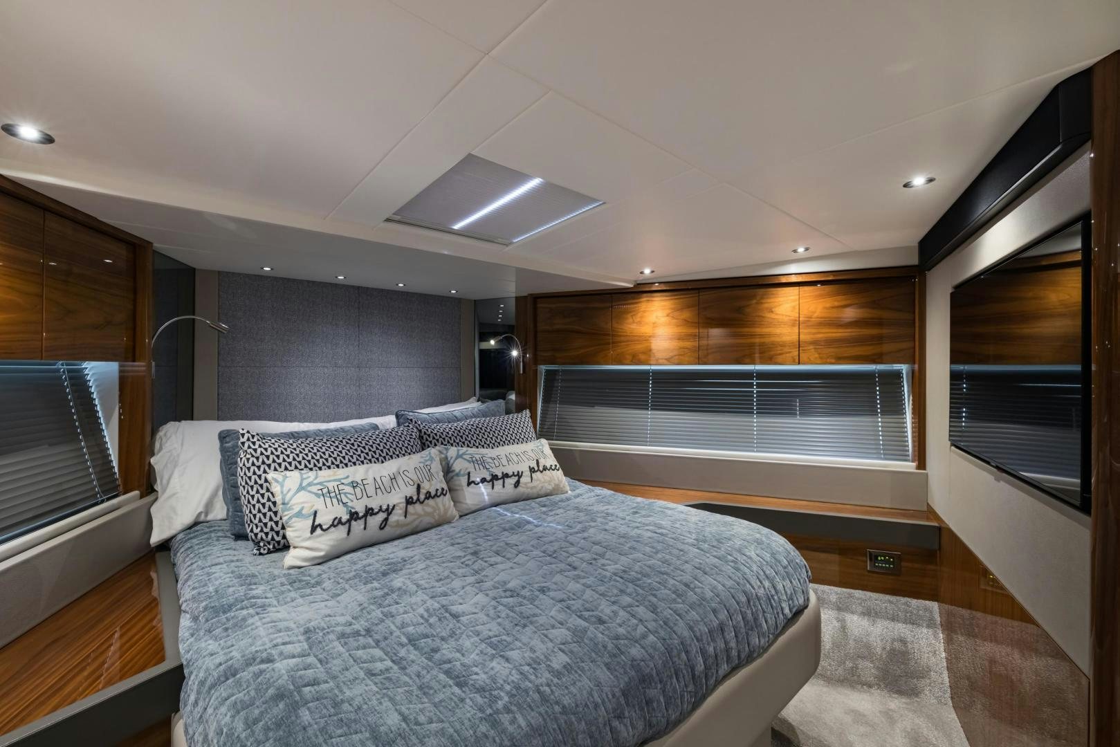 a bedroom with a large bed aboard MR. G Yacht for Sale
