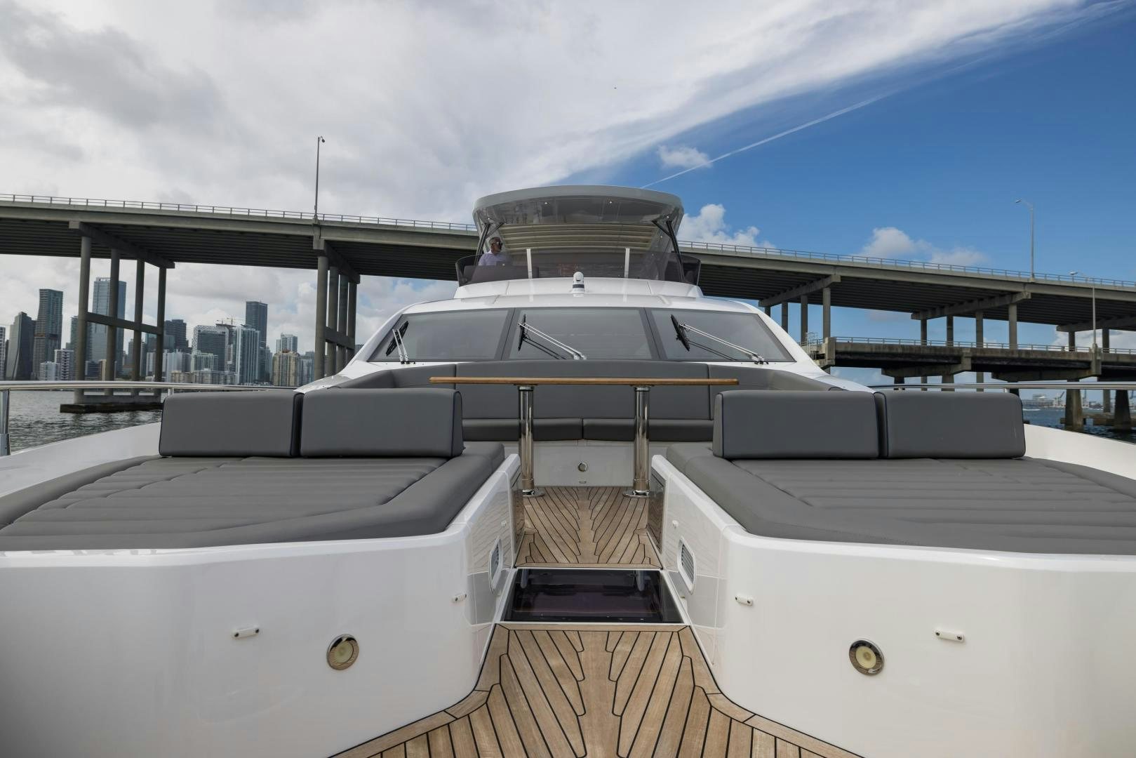 a white boat on a deck aboard MR. G Yacht for Sale