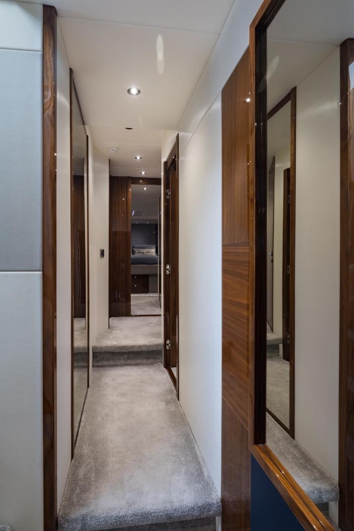a hallway with doors aboard MR. G Yacht for Sale