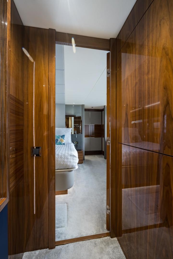 a room with a bed and a closet aboard MR. G Yacht for Sale