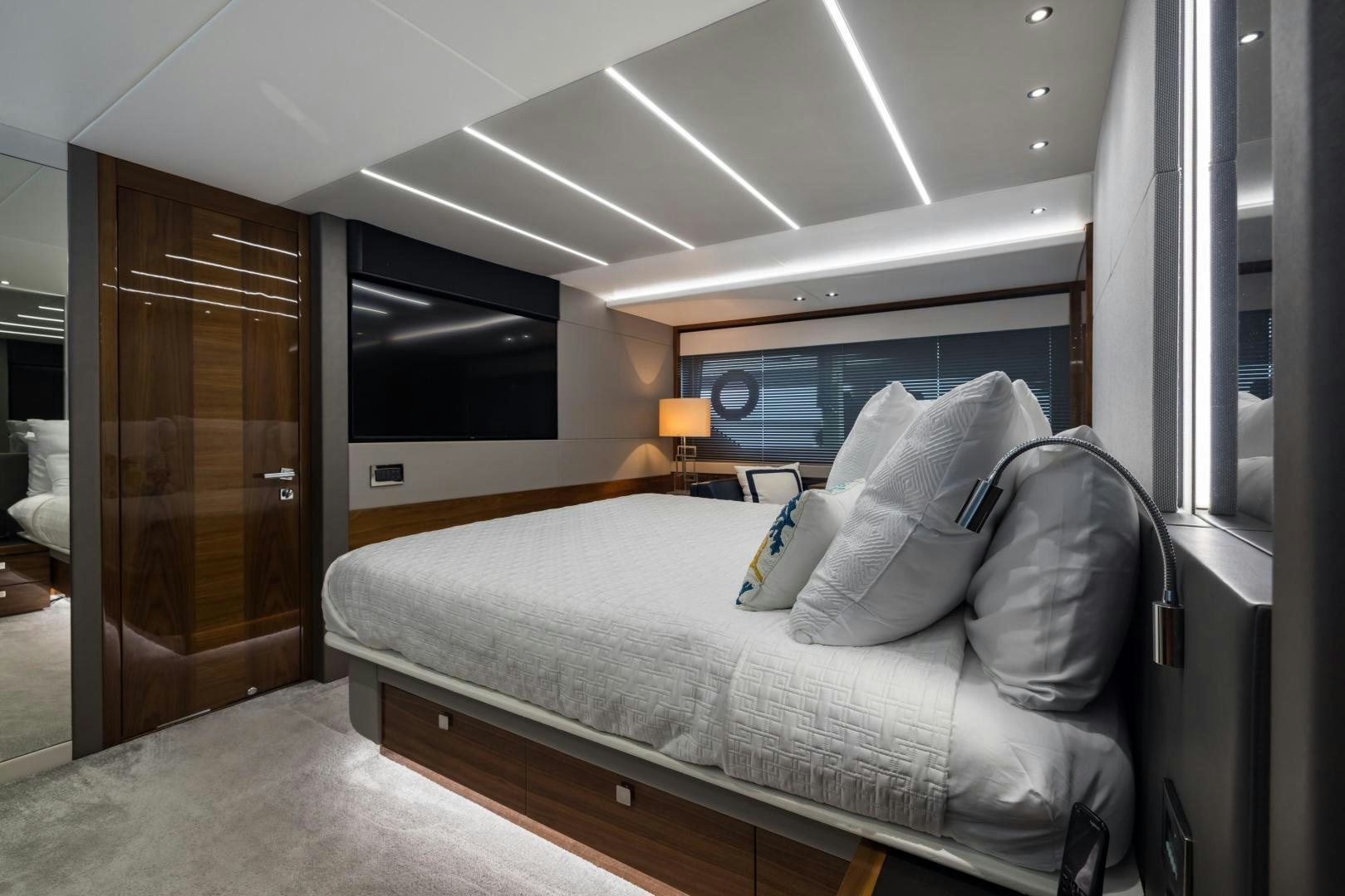 a bed in a room aboard MR. G Yacht for Sale