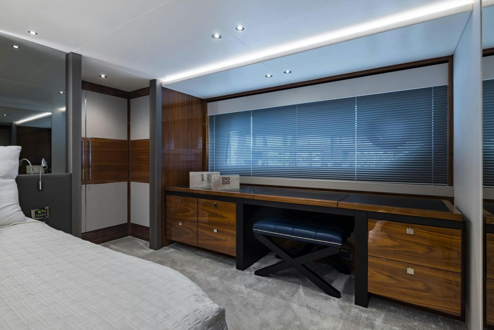 a room with a bed and a desk aboard MR. G Yacht for Sale