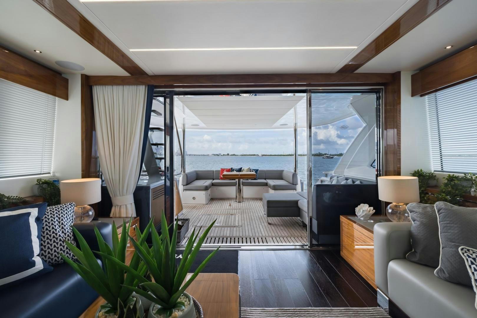 a living room with a large window aboard MR. G Yacht for Sale